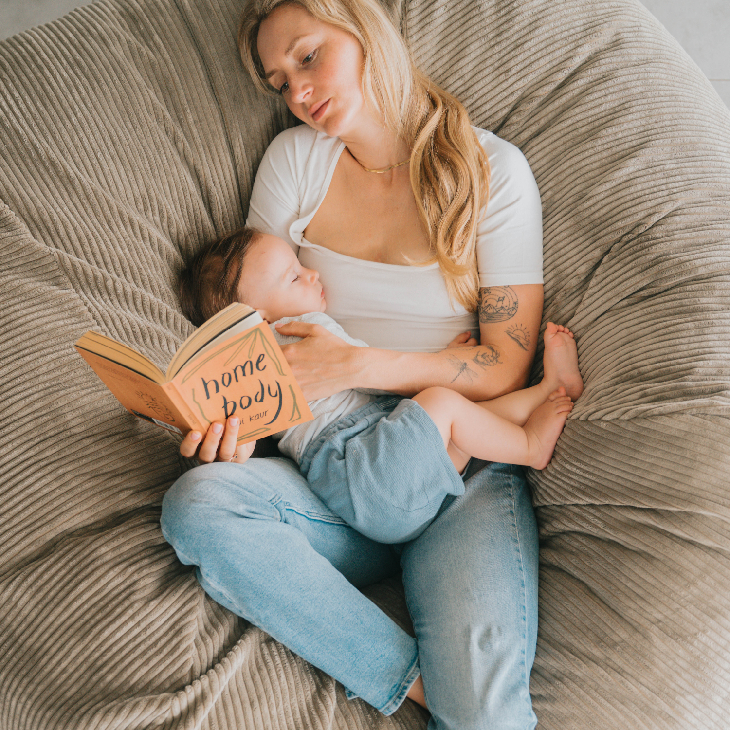 A young mother cuddlinng her son on a premium XL dunes bean bag
