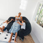 A young family on a premium Taylor made bean bag