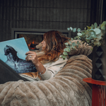 A lady sitting on a Taylor Made and Designs eskimo XL bean bag
